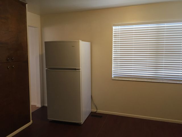 Kitchen window, refirgerator & pantry cabinets