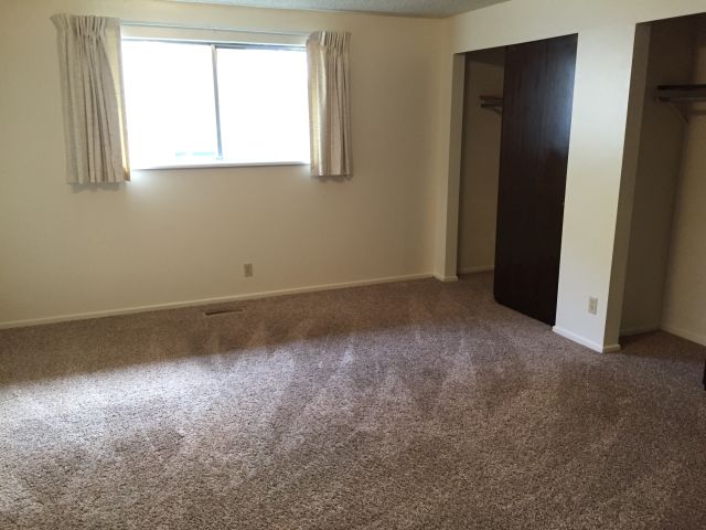 Master bedroom has a large window and 2 large closets